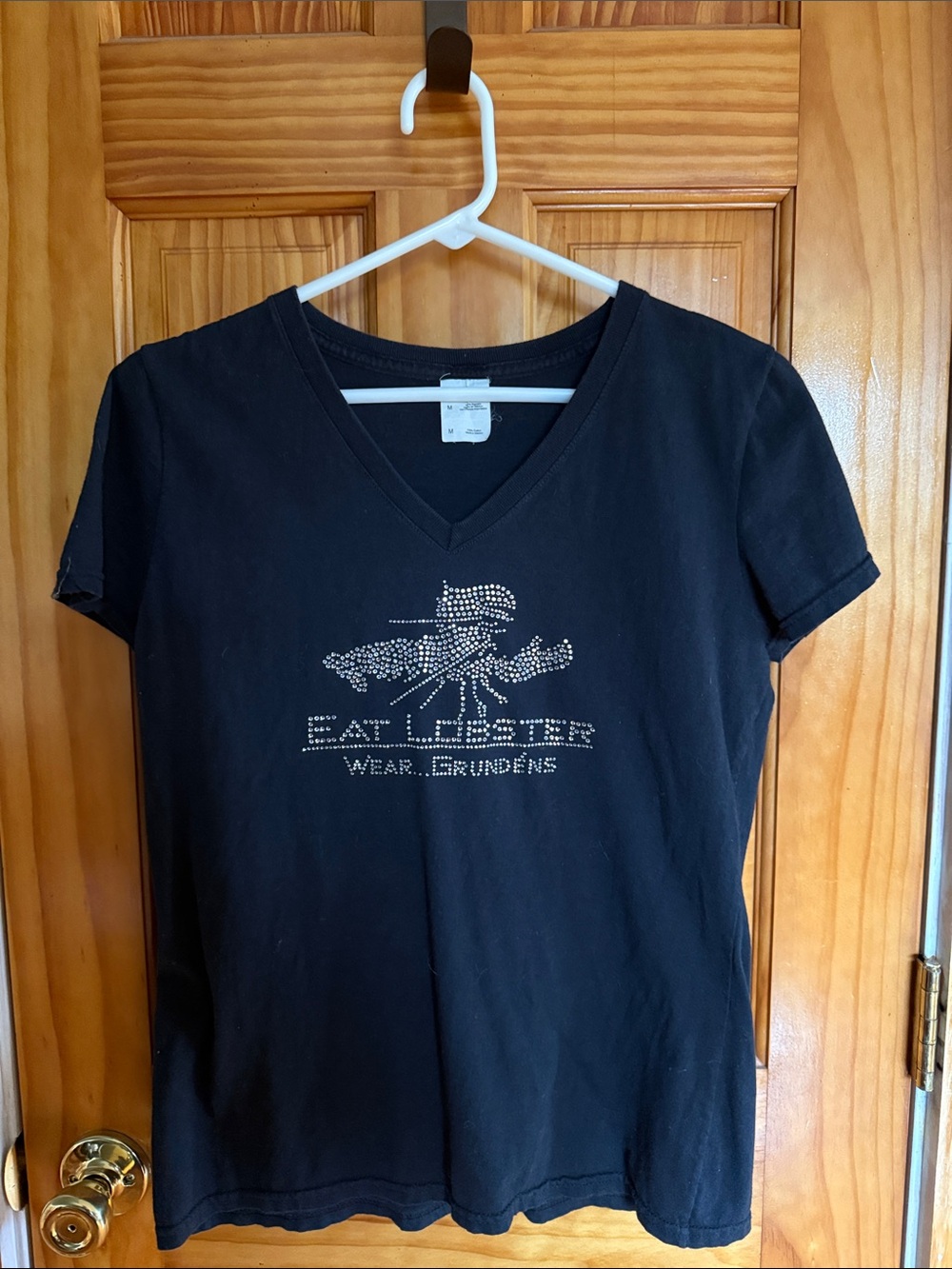 Black V-Neck Women’s Tee with Embellished Logo